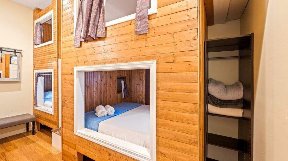 Built-in wood bunk pods with privacy curtains